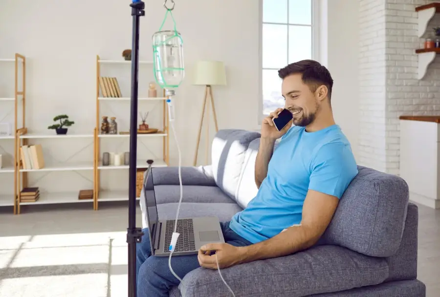 a person sitting on a couch talking on a phone