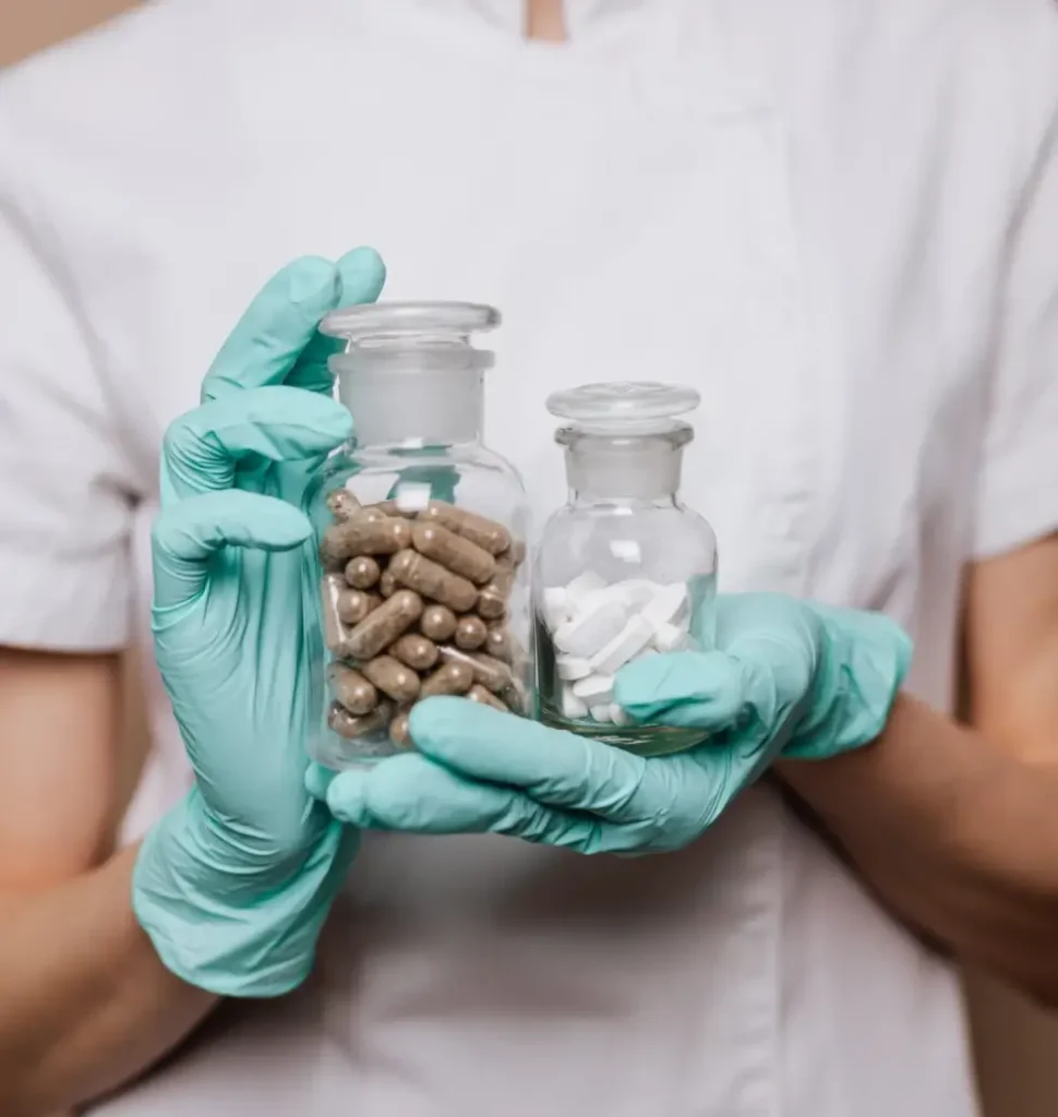 a-person-holding-a-bottle-of-pills-1